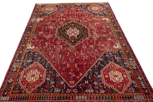 Surface texture of 2000s Shiraz rug with natural Wool and intricate pattern