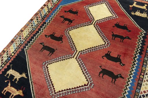 Backside of handmade 2000s Shiraz rug showing knot structure and weave density