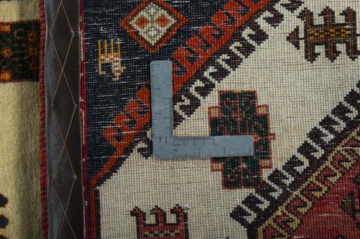 Corner detail of 2000s Shiraz rug showing border pattern and Wool pile