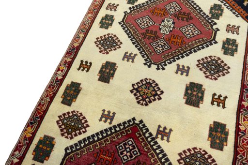 Backside of handmade 2000s Shiraz rug showing knot structure and weave density