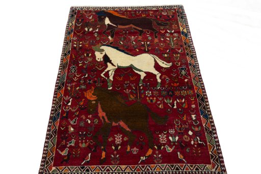 Surface texture of 2000s Shiraz rug with natural Wool and intricate pattern