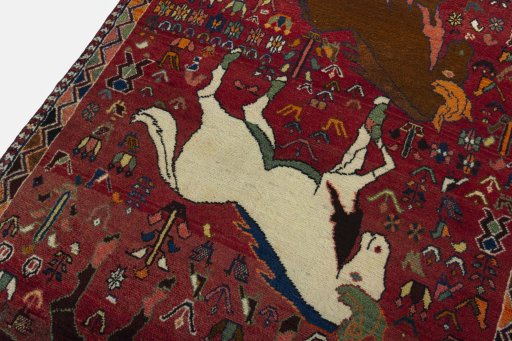 Backside of handmade 2000s Shiraz rug showing knot structure and weave density