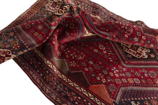 Corner detail of 2000s Shiraz rug showing border pattern and Wool pile