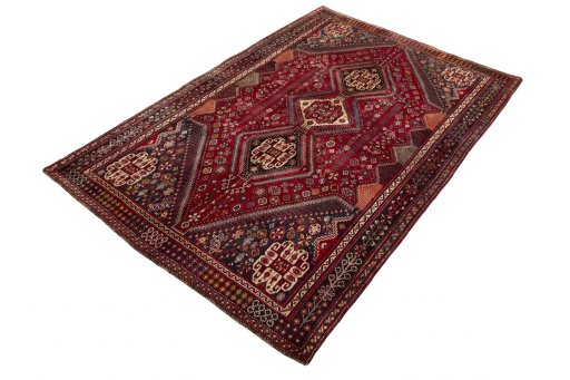 Corner detail of 2000s Shiraz rug showing border pattern and Wool pile