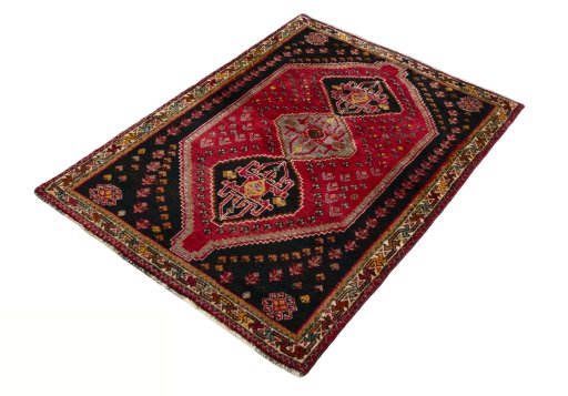 Corner detail of 2000s Shiraz rug showing border pattern and Wool pile