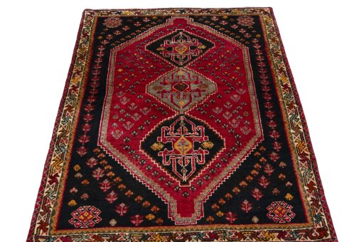 Surface texture of 2000s Shiraz rug with natural Wool and intricate pattern