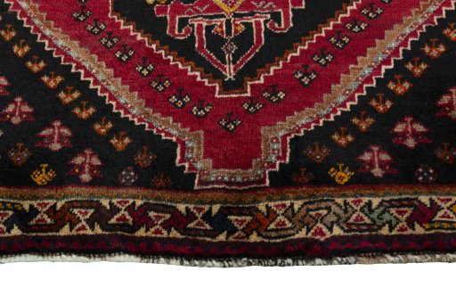 Central medallion detail of 2000s Shiraz rug from Iran / Persia