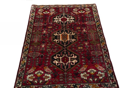Surface texture of 2000s Shiraz rug with natural Wool and intricate pattern
