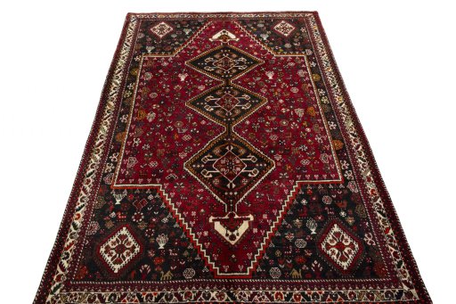 Surface texture of 2000s Shiraz rug with natural Wool and intricate pattern