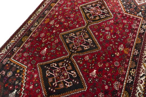 Backside of handmade 2000s Shiraz rug showing knot structure and weave density