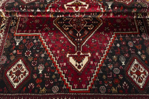 Full view of 2000s Shiraz rug from Iran / Persia, 268 × 167 cm in Red tones