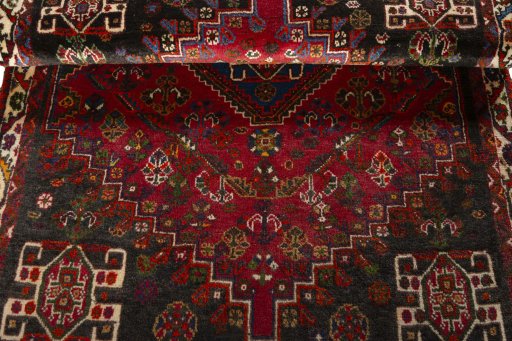 Corner detail of 2000s Shiraz rug showing border pattern and Wool pile