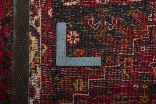 Surface texture of 2000s Shiraz rug with natural Wool and intricate pattern