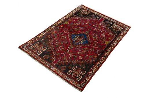 Corner detail of 2000s Shiraz rug showing border pattern and Wool pile