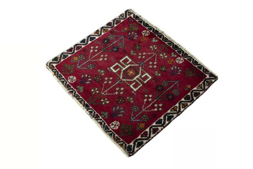 Corner detail of 2000s Shiraz rug showing border pattern and Wool pile