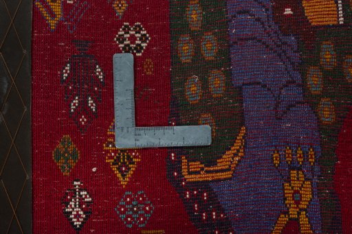 Backside of handmade 2000s Shiraz rug showing knot structure and weave density
