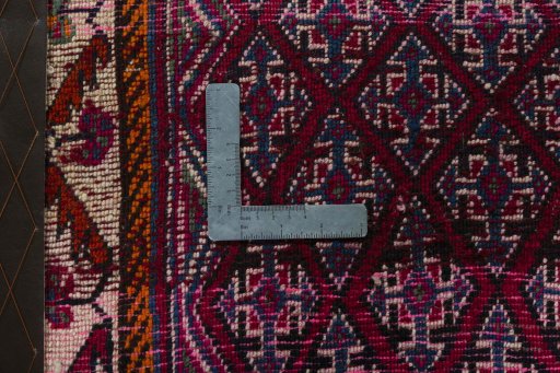 Backside of handmade 2000s Shiraz rug showing knot structure and weave density