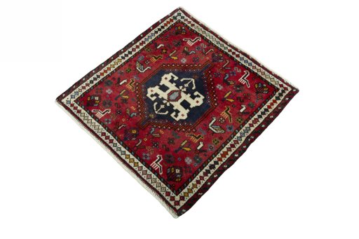 Corner detail of 2000s Shiraz rug showing border pattern and Wool pile