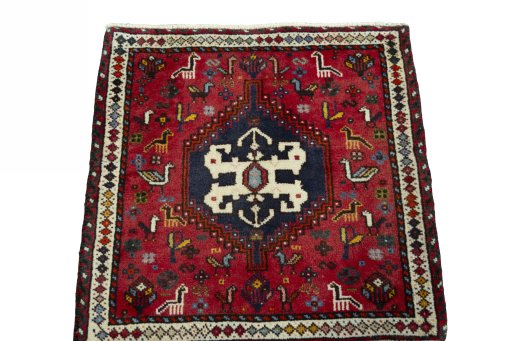 Surface texture of 2000s Shiraz rug with natural Wool and intricate pattern