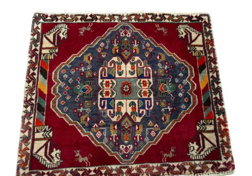 Surface texture of 2000s Shiraz rug with natural Wool and intricate pattern