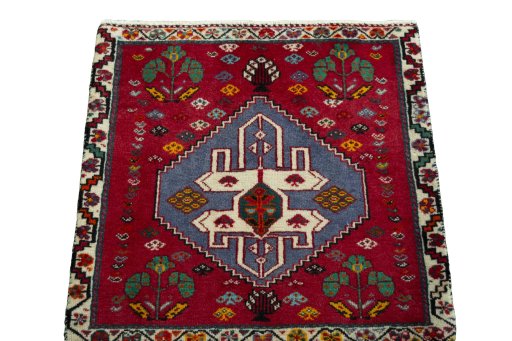 Surface texture of 2000s Shiraz rug with natural Wool and intricate pattern
