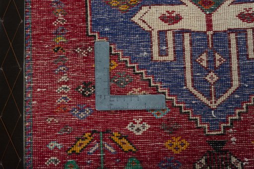 Backside of handmade 2000s Shiraz rug showing knot structure and weave density