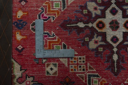Backside of handmade 2000s Shiraz rug showing knot structure and weave density