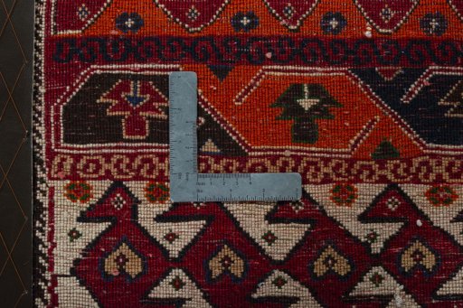 Backside of handmade 2000s Shiraz rug showing knot structure and weave density