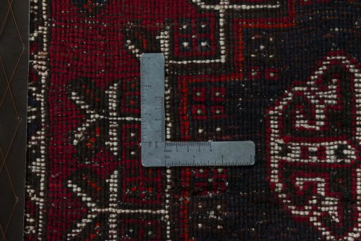 Backside of handmade 2000s Shiraz rug showing knot structure and weave density