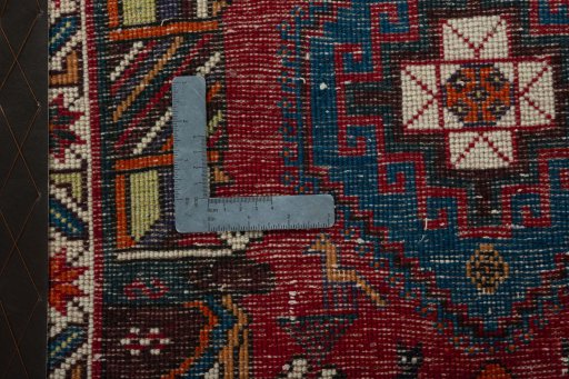 Backside of handmade 2000s Shiraz rug showing knot structure and weave density