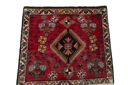 Surface texture of 2000s Shiraz rug with natural Wool and intricate pattern