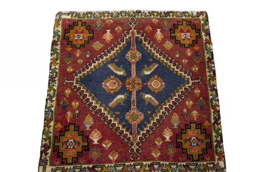 Surface texture of 2000s Shiraz rug with natural Wool and intricate pattern