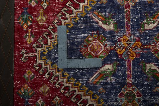 Backside of handmade 2000s Shiraz rug showing knot structure and weave density