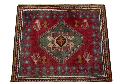 Surface texture of 2000s Shiraz rug with natural Wool and intricate pattern