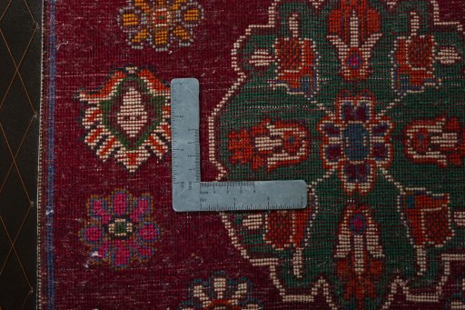Backside of handmade 2000s Shiraz rug showing knot structure and weave density