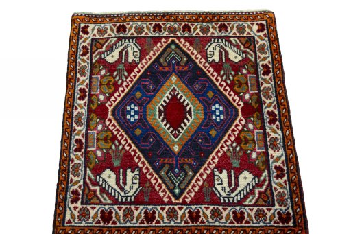 Surface texture of 2000s Shiraz rug with natural Wool and intricate pattern