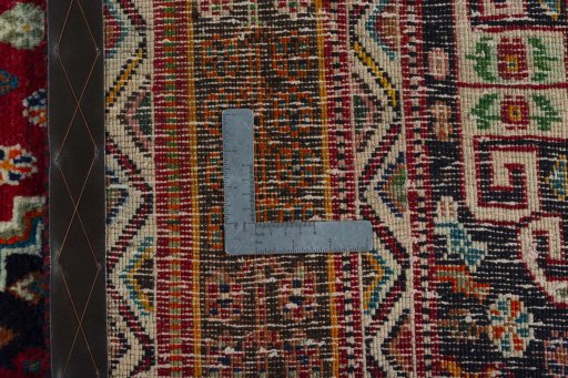 Surface texture of 2000s Shiraz rug with natural Wool and intricate pattern
