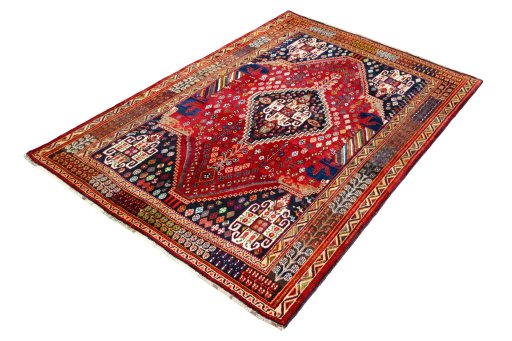 Corner detail of 2000s Shiraz rug showing border pattern and Wool pile