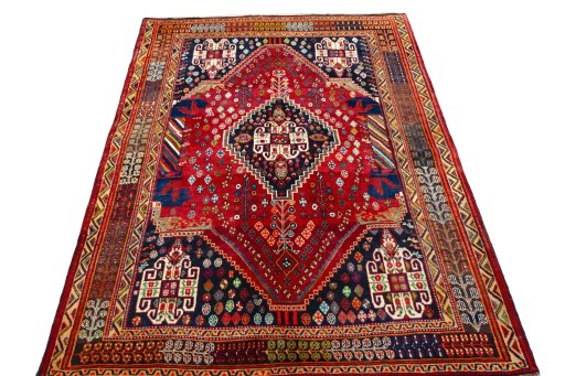 Surface texture of 2000s Shiraz rug with natural Wool and intricate pattern