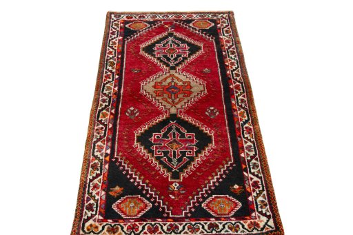 Surface texture of 2000s Shiraz rug with natural Wool and intricate pattern