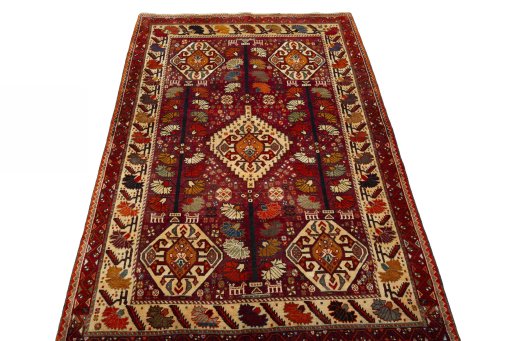Surface texture of 2000s Shiraz rug with natural Wool and intricate pattern