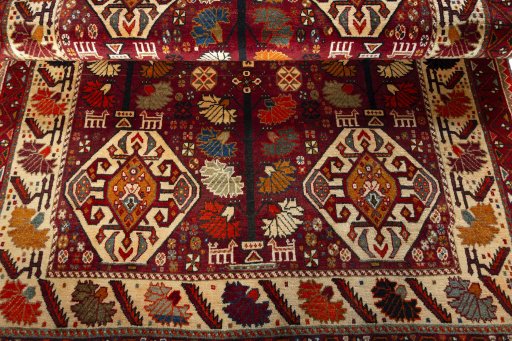 Full view of 2000s Shiraz rug from Iran / Persia, 250 × 155 cm in Red tones