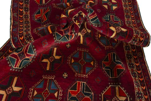 Corner detail of 2000s Shiraz rug showing border pattern and Wool pile