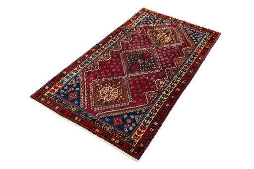 Corner detail of 2000s Shiraz rug showing border pattern and Wool pile