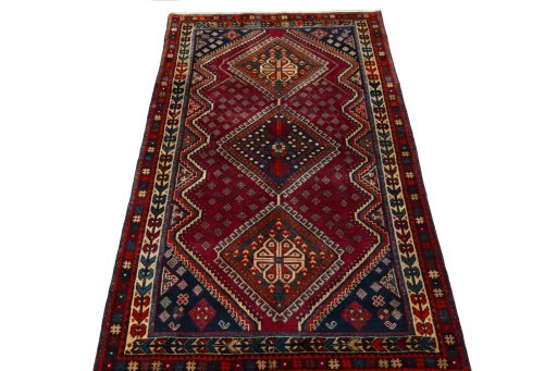 Surface texture of 2000s Shiraz rug with natural Wool and intricate pattern