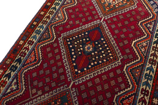 Backside of handmade 2000s Shiraz rug showing knot structure and weave density