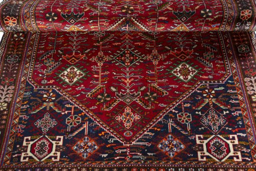 Corner detail of 2000s Shiraz rug showing border pattern and Wool pile