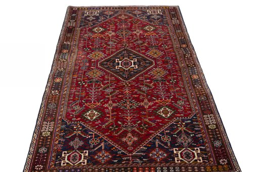 Surface texture of 2000s Shiraz rug with natural Wool and intricate pattern