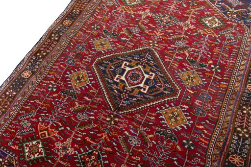 Backside of handmade 2000s Shiraz rug showing knot structure and weave density