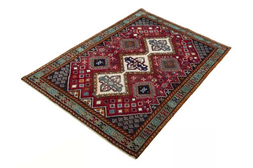 Corner detail of 2000s Shiraz rug showing border pattern and Wool pile